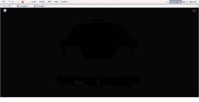 a computer screen with a red car in the background