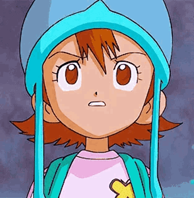 a cartoon girl wearing a blue hat and a pink shirt is making a funny face .