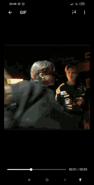 a phone screen shows a gif of a group of people
