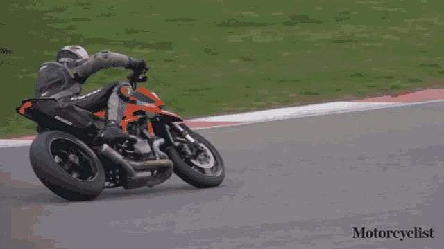 a motorcyclist is going around a curve on a race track