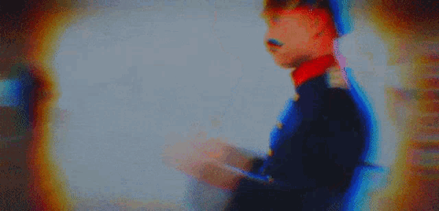 a blurry picture of a person 's feet with a rainbow colored background