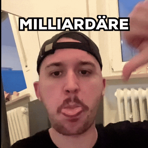 a man with a beard wearing a baseball cap with the word milliardare written on it