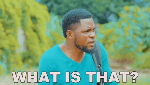a man in a blue shirt says " what is that " in white letters