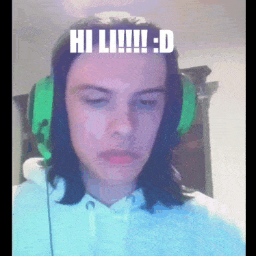 a person wearing green headphones says hi li !!!