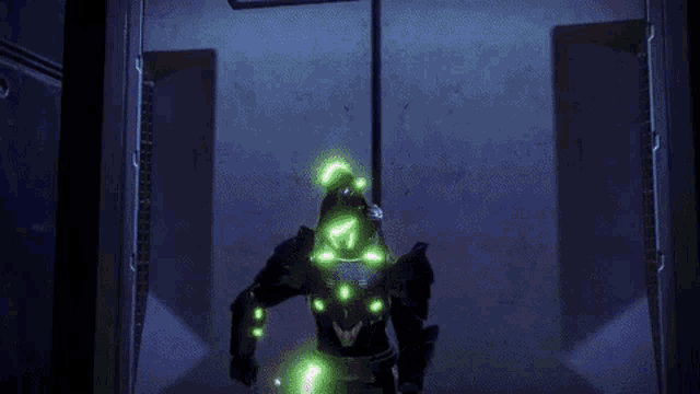 a video game character is standing in a purple room with green lights coming out of his armor .