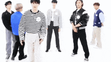 a group of young men are standing next to each other