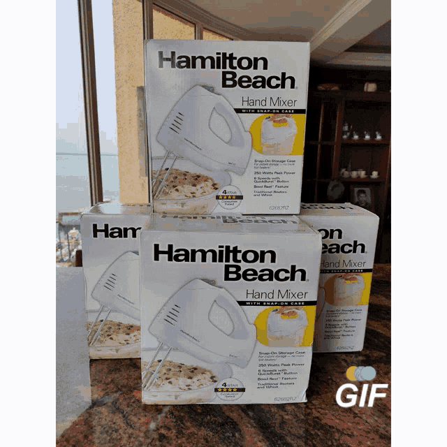 three boxes of hamilton beach hand mixers are on a counter