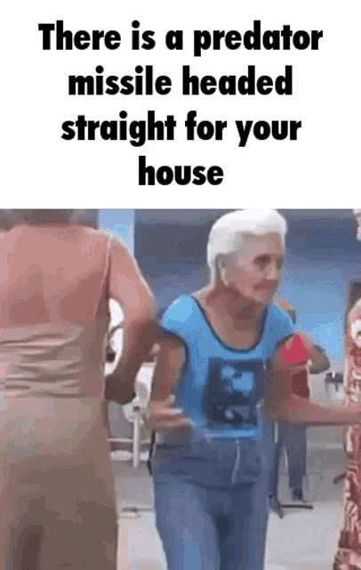 an elderly woman is dancing in a room with a caption that says there is a predator missile headed straight for your house