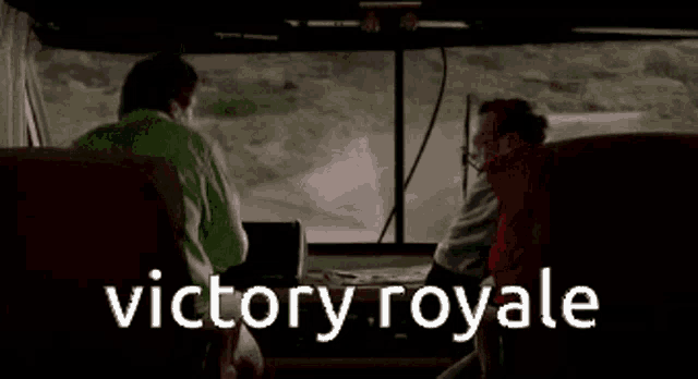 two people are sitting in a bus with the words victory royale written on the screen