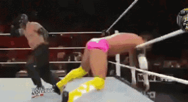 two wrestlers are fighting in a ring with the words wlive on the bottom