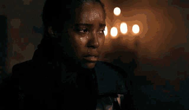 a woman with a tear coming out of her eye