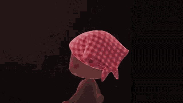 a cartoon character is wearing a red and white checkered bandana .