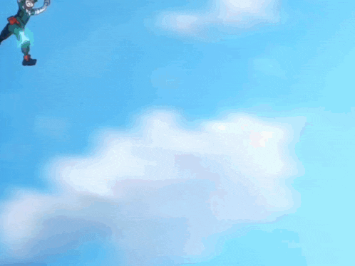 a red hand is reaching up into the sky
