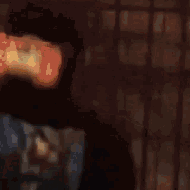 a close up of a person 's hand holding a bag of food