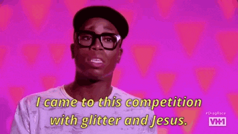 a man with glasses and a hat is talking about a competition with glitter and jesus .