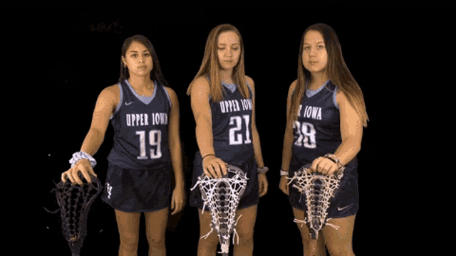 three lacrosse players from upper iowa pose for a photo
