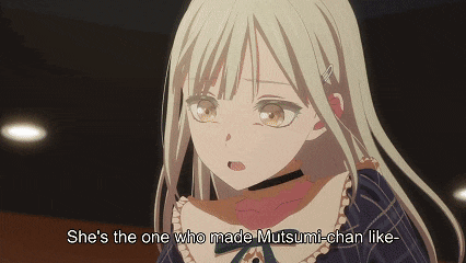 a blonde anime girl with the words she 's the one who made mutsumi-chan like written above her