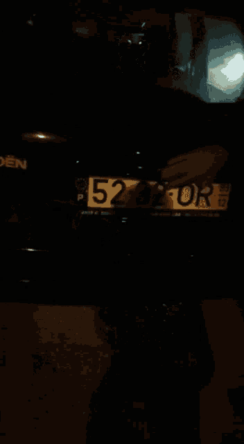 a black car with a license plate that says 5292 204
