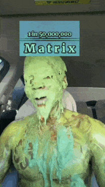 a man is covered in green paint with a sign that says 1 in 50,000,000 matrix