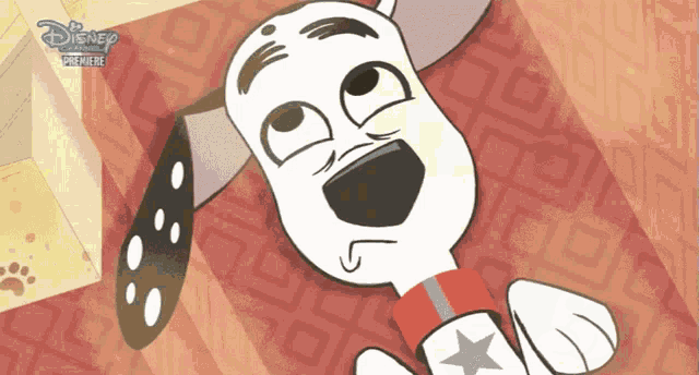 a dalmatian dog from the disney channel laying on a rug