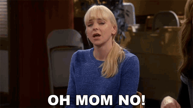 a woman in a blue sweater is saying " oh mom no "