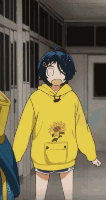 a girl wearing a yellow hoodie with a sunflower on the pocket