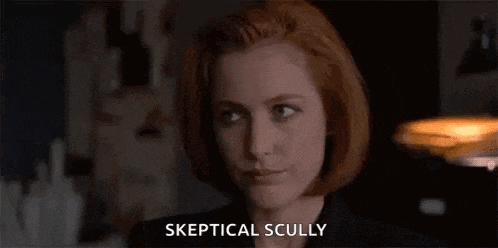 a close up of a woman 's face with the words skeptical scully written on it .