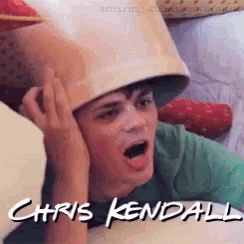 a young man wearing a bucket on his head with the name chris kendall written below him
