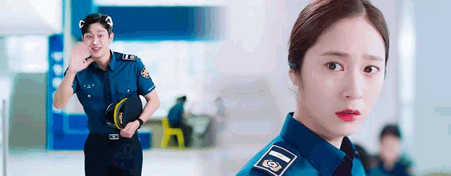 a man in a police uniform is waving at a woman in a police uniform