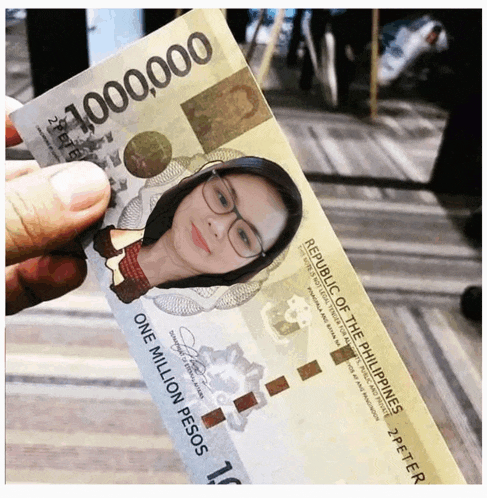 a person is holding up a one million pesos bill