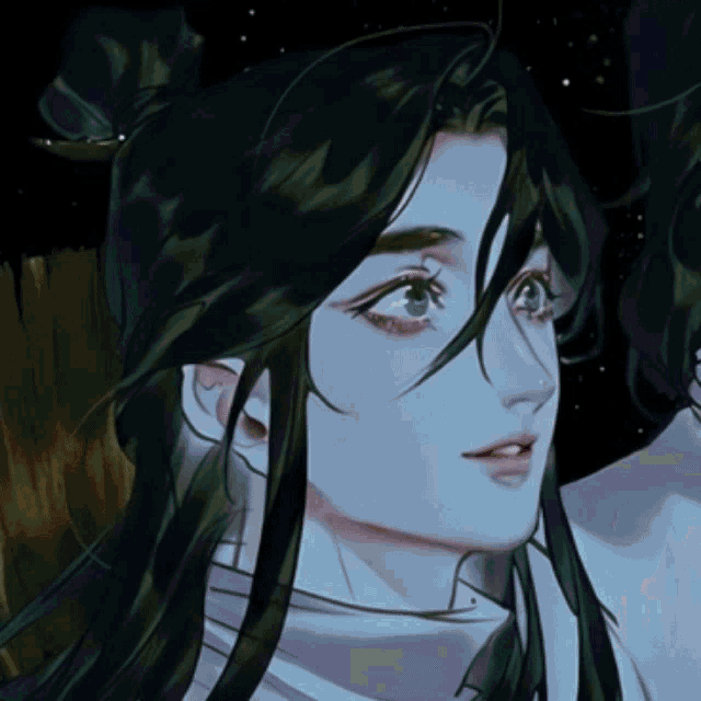 a close up of a person 's face with long hair and blue eyes