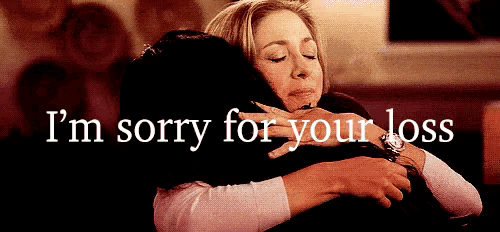 a woman hugging another woman with the words " i 'm sorry for your loss " on the bottom