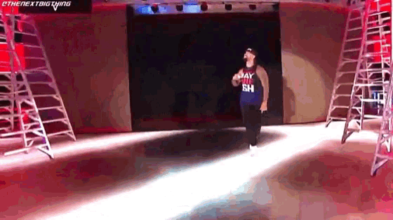 a man is walking down a stage wearing a jersey that says ' may the eh ' on it
