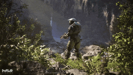 a man in a halo armor is holding a glowing object