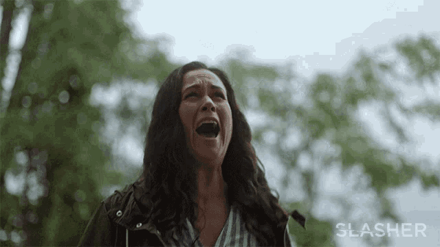 a woman is screaming with the word slasher on the bottom