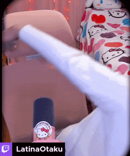 a person with a hello kitty sticker on their thumb