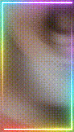 a rainbow neon frame with a blurry background