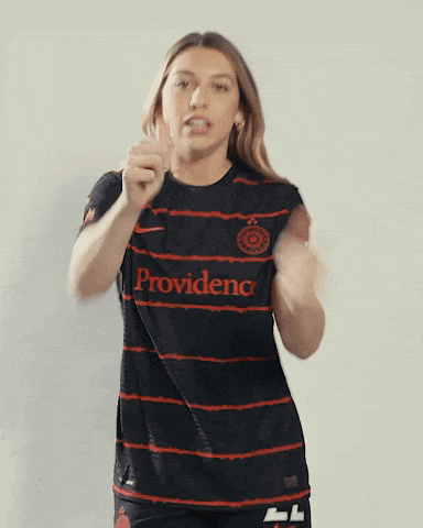 a woman wearing a black and red striped shirt that says providence on it
