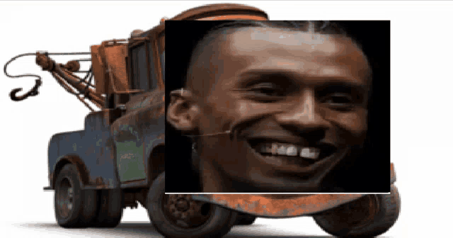 a tow truck has a picture of a man on the front of it
