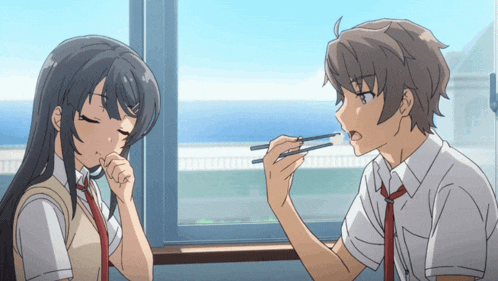 a boy and a girl are sitting next to each other eating with chopsticks
