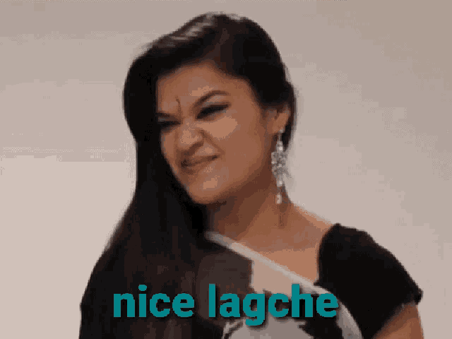 a woman is making a funny face and the words nice lagche are behind her .