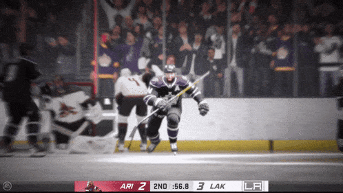 a hockey game is being played and the score is 3 to 2