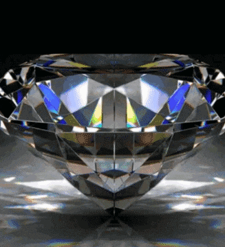 a diamond with a black background and a reflection of the diamond