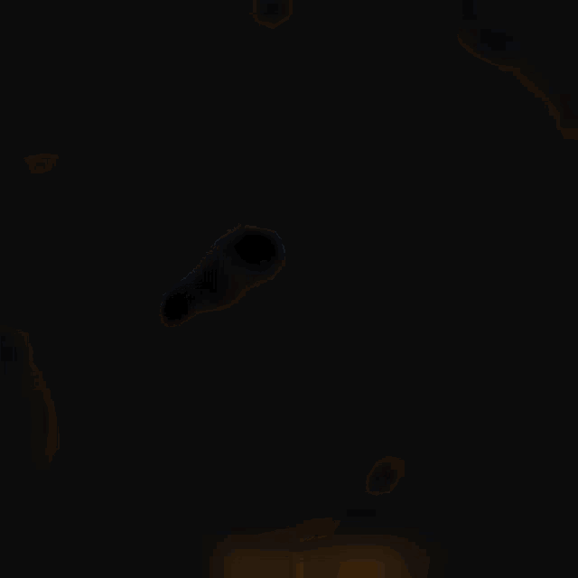 a blurry picture of a brown bear 's face with a black background .