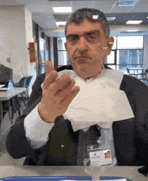 a man with a name tag that says antonio