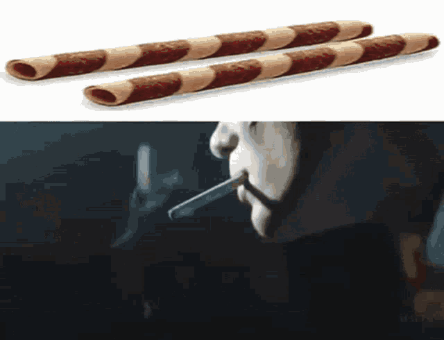 a man is smoking a cigarette next to a picture of two wafer sticks .