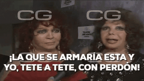 two women are talking into a microphone with the words cg cg written above them