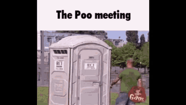 a man is walking towards a portable toilet with the words the poo meeting written on it .