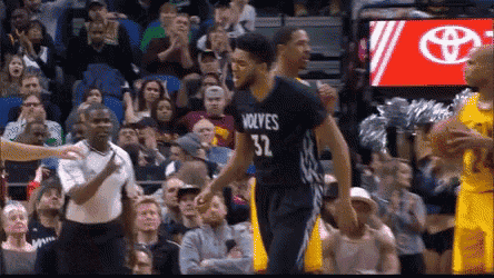 a basketball player wearing a jersey that says wolves 32