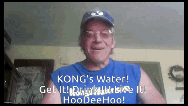 a man is wearing a blue shirt that says kong 's water get it drink it live it hoodeehoo